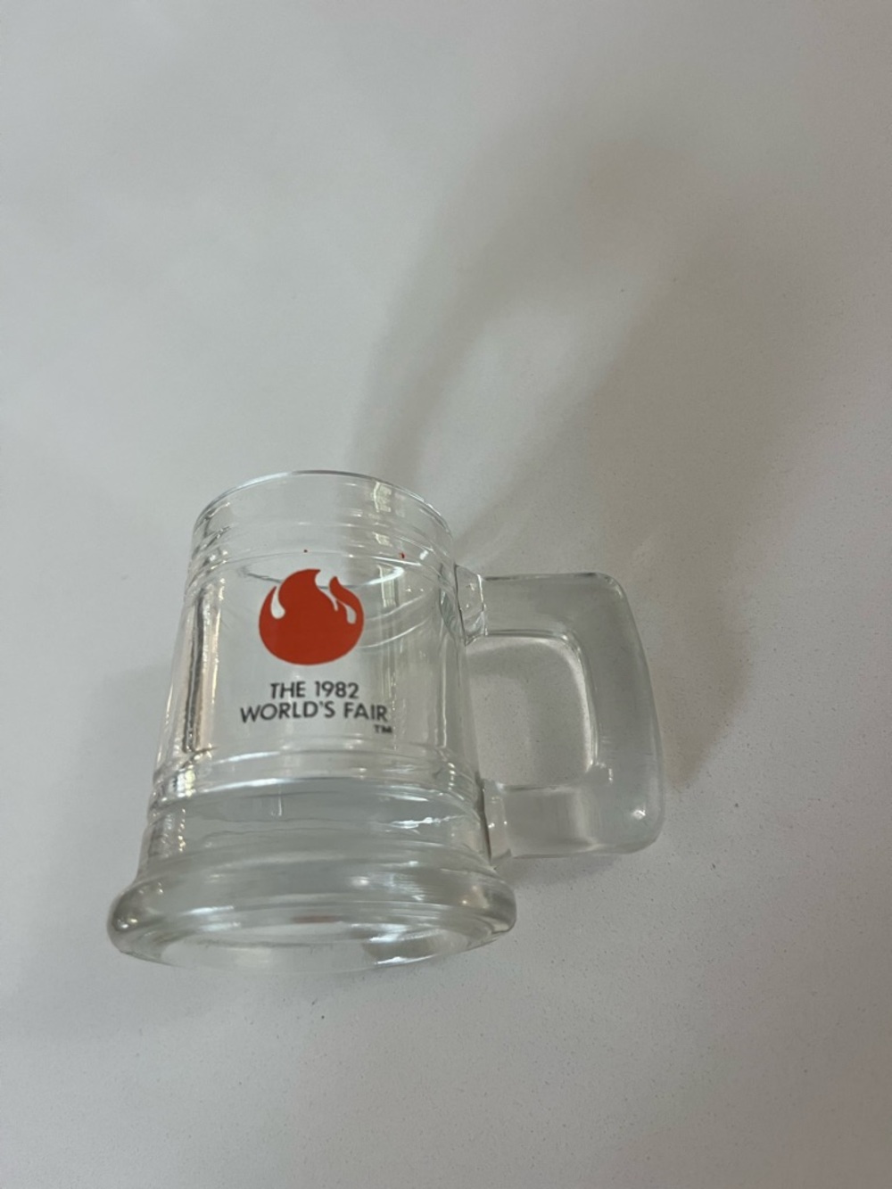 World’s Fair Clear Glass Mini Mug with Red Flame Logo